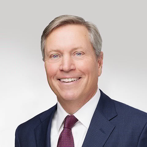 Brian Doyle professional headshot with gray background.