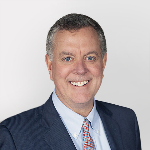 Erik Dahlberg professional headshot with gray background.