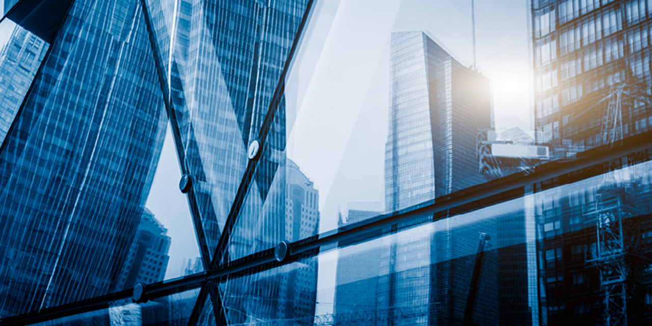 Abstract image of buildings reflected in glass windows